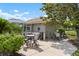 An outdoor kitchen and dining area with a built-in grill and seating at 9630 Club South Cir # 6201, Sarasota, FL 34238