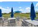 Outdoor patio seating offers views of the pristine golf course and blue skies, perfect for relaxing at 9630 Club South Cir # 6201, Sarasota, FL 34238