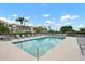 Community pool with lounge chairs and views of the building, perfect for a refreshing swim at 9630 Club South Cir # 6201, Sarasota, FL 34238