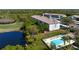 A view of a community pool featuring lounge chairs for relaxation surrounded by well-maintained landscaping at 9630 Club South Cir # 6201, Sarasota, FL 34238