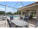Outdoor dining and pool area for entertaining at 9630 Club South Cir # 6201, Sarasota, FL 34238