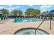 Inviting pool and hot tub with surrounding lounge chairs and lush landscaping, ideal for relaxation at 9630 Club South Cir # 6201, Sarasota, FL 34238