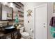 Modern bathroom showcasing a unique sink, decorative wall accents, and a vanity at 10615 Boyette Creek Blvd, Riverview, FL 33569