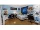 Well lit bedroom featuring blue walls, hardwood floors, and plenty of space for desk, dresser, and decorations at 10615 Boyette Creek Blvd, Riverview, FL 33569