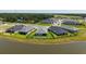 Aerial view of backyard featuring a fenced yard, patio furniture, and a water view at 11869 Richmond Trl, Parrish, FL 34219