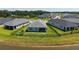 Aerial view of backyard featuring a fenced yard, patio furniture, and a water view at 11869 Richmond Trl, Parrish, FL 34219