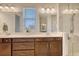Spacious bathroom features double sinks, large mirrors, and a glass-enclosed shower at 11869 Richmond Trl, Parrish, FL 34219