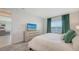 Bright bedroom with white walls, plush carpet, and stylish decor with a view of the community at 11869 Richmond Trl, Parrish, FL 34219