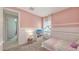 Cozy bedroom with plush carpet, natural light, and a decorative house frame bed at 11869 Richmond Trl, Parrish, FL 34219