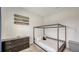 Bedroom featuring a four-post bed, dresser, and decorative Star Wars decor at 11869 Richmond Trl, Parrish, FL 34219