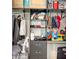 A walk-in closet featuring shelves, clothing, and suitcases at 11869 Richmond Trl, Parrish, FL 34219