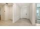 Bright and welcoming entrance hallway with tile flooring and access to various rooms in the home at 11869 Richmond Trl, Parrish, FL 34219