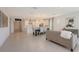 Bright open-concept living space connecting the kitchen, dining, and lounge areas at 11869 Richmond Trl, Parrish, FL 34219