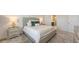 Calm main bedroom showcases bedside tables with lamps and soft decor at 11869 Richmond Trl, Parrish, FL 34219