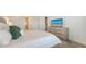 Comfortable main bedroom featuring a large bed and dresser with mounted television at 11869 Richmond Trl, Parrish, FL 34219