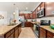This updated kitchen features stainless steel appliances, granite countertops and plenty of cabinet space at 12501 Cinqueterre Dr, Venice, FL 34293