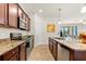 Spacious eat-in kitchen featuring stainless steel appliances, granite countertops and ample storage space at 12501 Cinqueterre Dr, Venice, FL 34293
