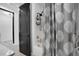 Bright bathroom with shower and gray patterned shower curtain at 14514 20Th E St, Parrish, FL 34219