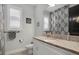 Bathroom with granite countertops, double windows, and a decorative shower curtain at 14514 20Th E St, Parrish, FL 34219