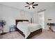 Cozy bedroom with a large bed, soft carpet, ceiling fan and walk in closet at 14514 20Th E St, Parrish, FL 34219