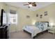 Inviting bedroom with ceiling fan, light walls, and a serene ambiance for relaxation at 14514 20Th E St, Parrish, FL 34219