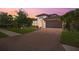 Charming single-Gathering home with a paved driveway, lush lawn, and mature landscaping at 14514 20Th E St, Parrish, FL 34219