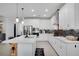 Modern kitchen featuring white cabinetry, stainless steel appliances, and a large center island with a quartz countertop at 14514 20Th E St, Parrish, FL 34219