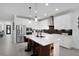 Modern kitchen featuring a large island, stainless steel appliances, and a stylish backsplash at 14514 20Th E St, Parrish, FL 34219