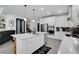 Modern kitchen featuring an island with seating and stainless steel appliances at 14514 20Th E St, Parrish, FL 34219