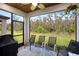 Enjoy outdoor living on this screened lanai overlooking the private backyard with beautiful views of nature at 14514 20Th E St, Parrish, FL 34219