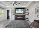Modern living room featuring fireplace, floating shelves, neutral paint, and recessed lighting at 14514 20Th E St, Parrish, FL 34219