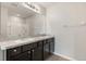 Bathroom features double sink vanity, large mirror and shower at 14914 Flowing Gold Dr, Bradenton, FL 34212