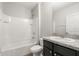Bathroom features tiled shower with tub and single sink vanity at 14914 Flowing Gold Dr, Bradenton, FL 34212