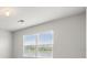 Bedroom with bright natural light from window overlooking scenic pond at 14914 Flowing Gold Dr, Bradenton, FL 34212
