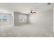 Bright, spacious main bedroom featuring neutral paint, carpeting, and windows with scenic views at 14914 Flowing Gold Dr, Bradenton, FL 34212