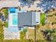 An aerial view showcases the property's layout, including a pool and landscaping at 1518 Stoeber Ave, Sarasota, FL 34232