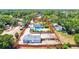 Aerial view of home on large lot with inground pool, studio, and fenced yard at 1518 Stoeber Ave, Sarasota, FL 34232