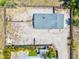 Aerial view of a home showcasing the backyard with a full perimeter fence at 1518 Stoeber Ave, Sarasota, FL 34232