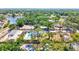Overhead view of the home with a pool, surrounded by mature trees and manicured landscaping at 1518 Stoeber Ave, Sarasota, FL 34232