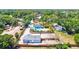 Aerial view showcasing the property with a pool, detached garage, and spacious yard at 1518 Stoeber Ave, Sarasota, FL 34232