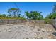 Spacious backyard enclosed by a wood fence, providing privacy at 1518 Stoeber Ave, Sarasota, FL 34232