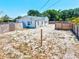 Large backyard with a fence, offering privacy and ample space for various activities at 1518 Stoeber Ave, Sarasota, FL 34232