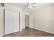 Bedroom with laminate floors, ceiling fan, closet, and neutral wall color at 1518 Stoeber Ave, Sarasota, FL 34232