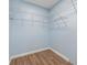 Walk in closet with hardwood floors and white wire shelving at 1518 Stoeber Ave, Sarasota, FL 34232