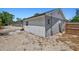 Home's exterior shows the side of the house and the backyard at 1518 Stoeber Ave, Sarasota, FL 34232