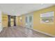 Bright living room with wood floors, French doors and large windows offering lots of natural light at 1518 Stoeber Ave, Sarasota, FL 34232