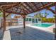 An outdoor pool with attached pergola, the perfect way to stay cool and beat the heat at 1518 Stoeber Ave, Sarasota, FL 34232