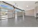 Spacious garage with epoxy flooring and modern doors with windows offering natural light at 1555 Eastbrook Dr, Sarasota, FL 34231