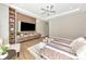 This main bedroom offers modern entertainment features, ample storage, and a calming light color palette at 1555 Eastbrook Dr, Sarasota, FL 34231