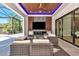 Enjoy this outdoor living area with a ceiling fan, recessed lighting, and a television at 1555 Eastbrook Dr, Sarasota, FL 34231